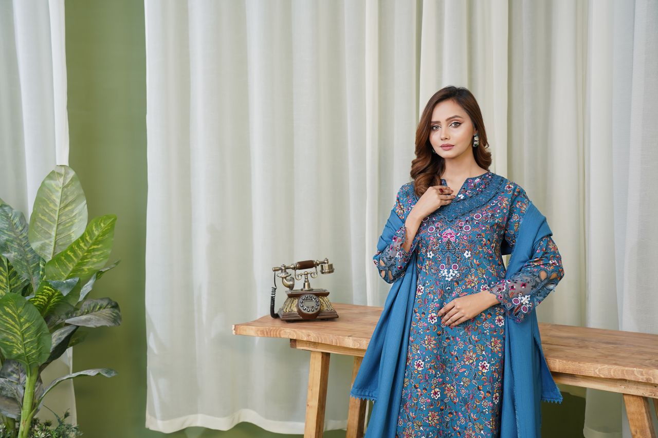 Model in traditional Pakistani dress capturing elegance in a Lahore studio setting.
